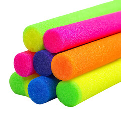 Brightly colored pool noodles stacked together for summer fun