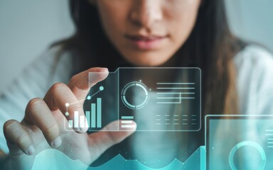 Woman holding a transparent device displaying digital data visualization for business intelligence and market analysis