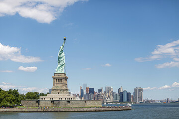 Statue of Liberty from the side and Lower Manhattan, New York