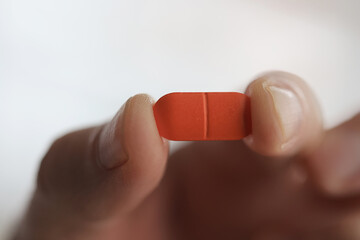 a lot of pills in the palm of a person's hand, medical background