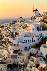 Fototapeta premium Santorini Greece. Oia. White houses and windmills at sunset