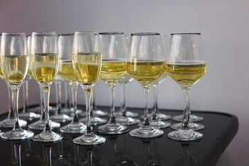 Elegant glassware lined up with sparkling beverage for a festive celebration in bright setting