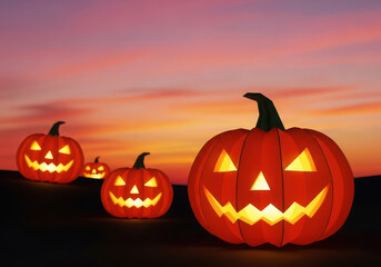 Glowing jack o lanterns against a dramatic sunset sky