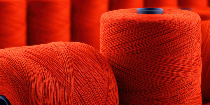 Red thread spools textile manufacturing industry concept - Powered by Adobe