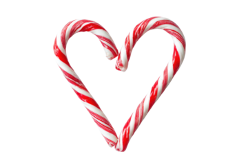 Two classic red and white candy canes elegantly form a heart shape against a solid transparent background, conveying love and festive spirit. background removed