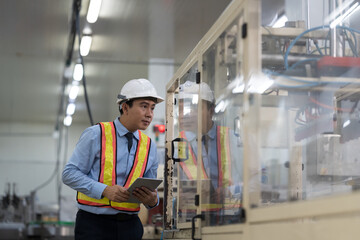 Male engineer, Industry factory. Asian male plant engineer working and checking operation of production system at industry factory