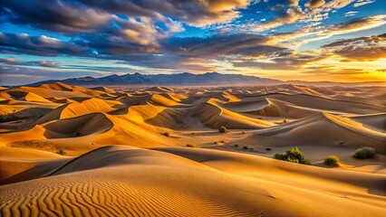 Dramatic desert dunes under a fiery sunset sky with sweeping clouds and golden sunlight