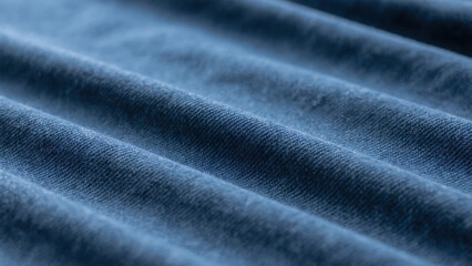 Close-up abstract textured fabric background with deep blue and purple tones and subtle light refractions creating a rich visual depth