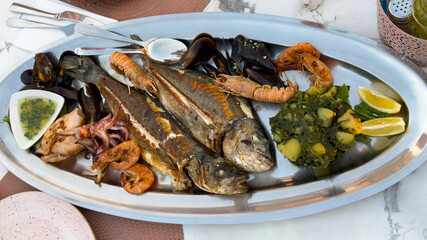 fried fish with lemon and herbs