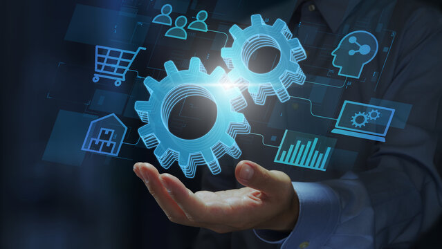 Application integration and API integration. Enterprise system with real-time data connectivity. Businessperson holding gear icons.
