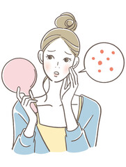 手鏡を見る女性