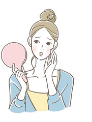 手鏡を見る女性