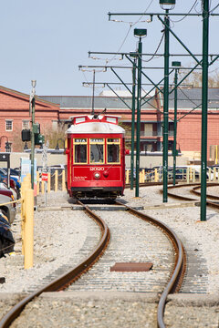 Classic red streetcar on the Canal Street line in New Orleans, part of the city&rsquo;s historic streetcar system and a popular mode of transport for locals and tourists.