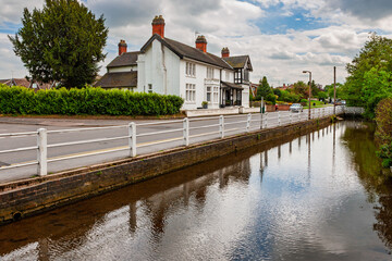 Burnside (street) running south through Rolleston-on-Dove alongside the brook. Some large houses in the county of Staffordshire, United Kingdom.