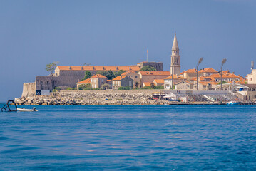Old Town and tower of John the Baptist cathedral in Budva town, Montenegro