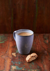 Cup of coffee on rustic wooden background. Soft focus. Copy space	