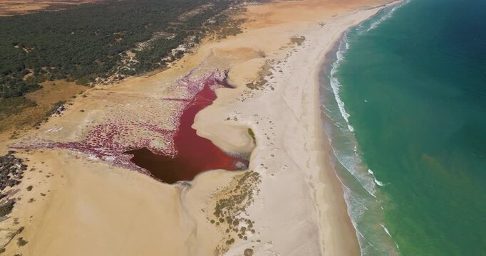 Aerial View Of Salt Flat WIth Red Water By The Beach In Socotra Island, Yemen.