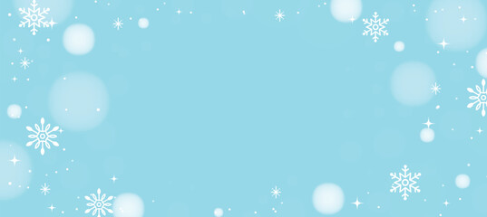 Light blue Christmas background with snowflakes, sparkles, and bokeh effects.