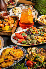 Christmas and New Year festive dinner table with drinks and appetizers