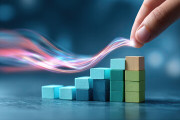 Hand placing wooden blocks on steps. Light streaks emanate from the top block