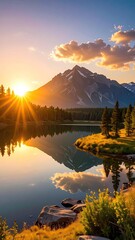 Serene Mountain Lake Reflection at Golden Hour with Sunburst and Clouds Dramatic Sky Scenic Landscape Mountain Peak Trees Water and Rocks