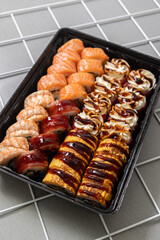 Set of fresh sushi on light background.