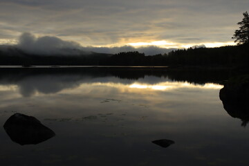 Dramatic Swedish lake scene ant dawn.