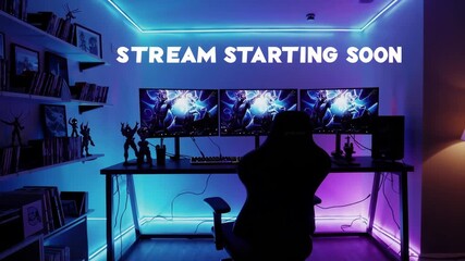 Neon gaming room setup with dual monitors and animated “stream starting soon” overlay.