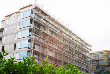 Modern architecture in progress – apartment building with panoramic glazing.