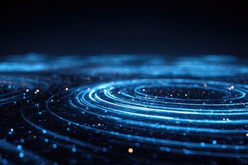 Abstract image showing concentric glowing rings of light, in a dark blue and black scene