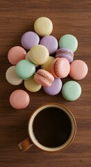 Obraz premium Gentle colorful macarons with a cup of coffee in a mug on wooden table background, top view. Sweet dessert and coffee break concept