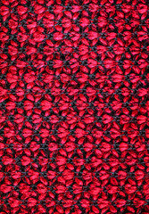 A red and black flower pattern material macro closeup