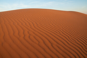 Natural designs and shapes in the sand, caused by the wind.