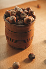 Nuts in a rustic wooden bowl create a cozy and inviting kitchen scene
