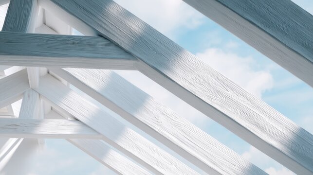 Close-up of a wooden structure with a blue sky and white clouds in the background. the structure appears to be made up of multiple wooden beams that are arranged in a diagonal pattern. - Powered by Adobe