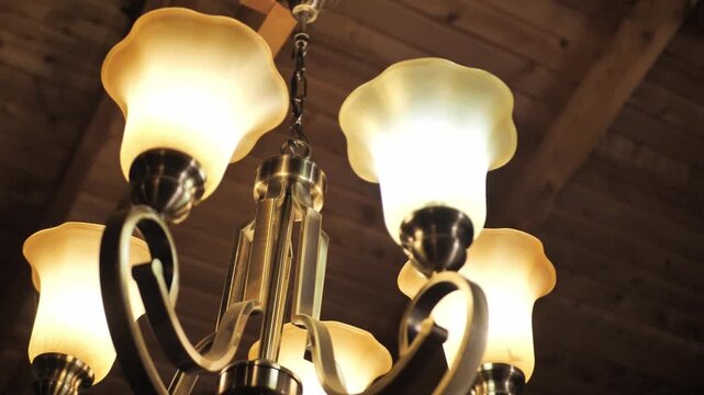 A Classic Vintage Multi-bulb Chandelier Hanging On The Ceiling. Low Angle Shot