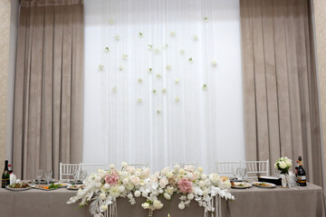 Festive table decorated with flowers. Festive decor.