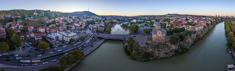 Tbilisi panorama with Kura river and Metekhi church at sunset © Aquarius