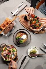 riends Toasting with Wine Over Gourmet Brunch