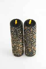 Decorative handmade candles with textured exterior and yellow wicks