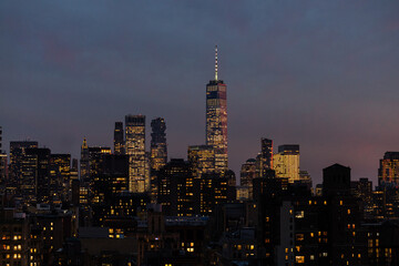 Freedom tower and downtown manhattan skyline on clear evening 