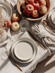 Overhead view of a dining table with pears and apples arranged on a linen tablecloth. Rustic and cozy composition, perfect for food photography, seasonal lifestyle, and wellness concepts.