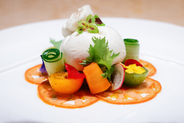 Close-up Burrata Cheese Salad with Colorful Vegetables and Edible Flowers