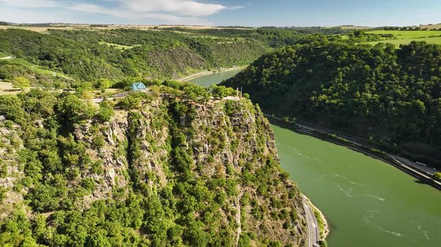 Aerial footage of famous Lorelei cliff on Rhine River in Upper Middle Rhine Valley, Germany. Panoramic view of steep rocky landscape of Lorelei cliff on Rhine River valley UNESCO World Heritage site.