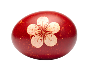 A single red easter egg adorned with a delicate white flower design isolated on transparent background