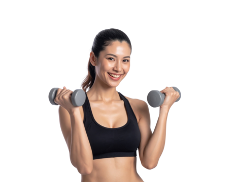 A smiling woman holds dumbbells, showcasing her fitness enthusiasm and strength in a workout pose.