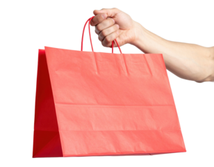 A hand holds a vibrant red shopping bag with handles, showcasing its simple yet eye-catching design.