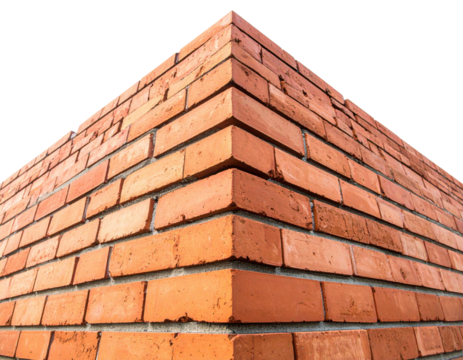 A close-up view of a corner of a brick wall, showcasing the texture and color of the red bricks against a black background.