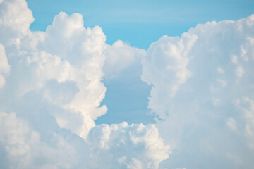 White fluffy cumulus clouds podium on blue sky with empty space background.Beauty cosmetic product placement pedestal present promotion minimal stand display,dreamy concept.
