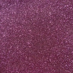 Sparkling pink glitter surface shines brightly under light creating a dazzling effect in any creative setting